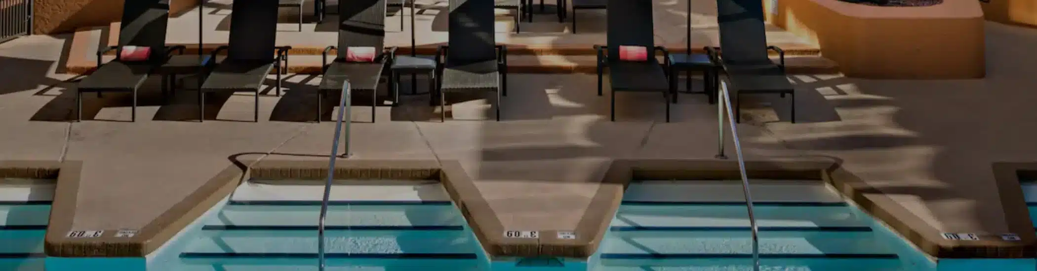 Clean resort pool deck with lounge chairs maintained by One Stop Property Services